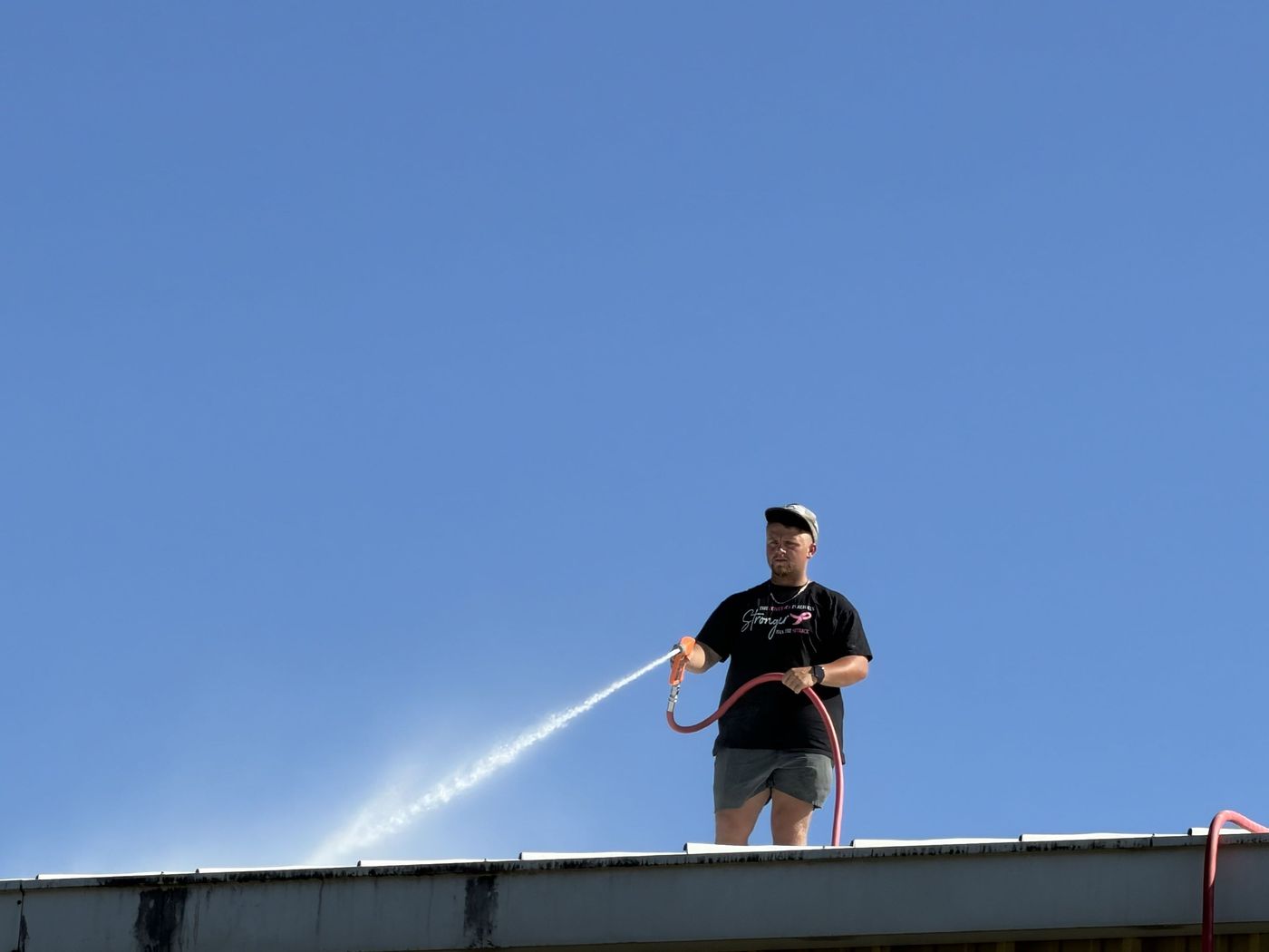 High-reach rinse work from a rooftop
